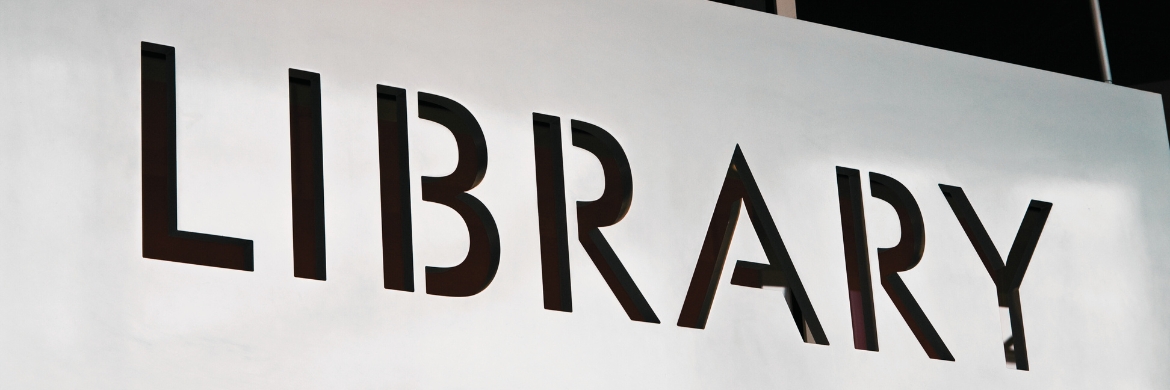 The word "Library" on a white wall