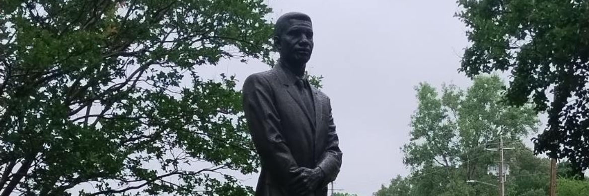 Statue of a man at the Medgar Evers Library