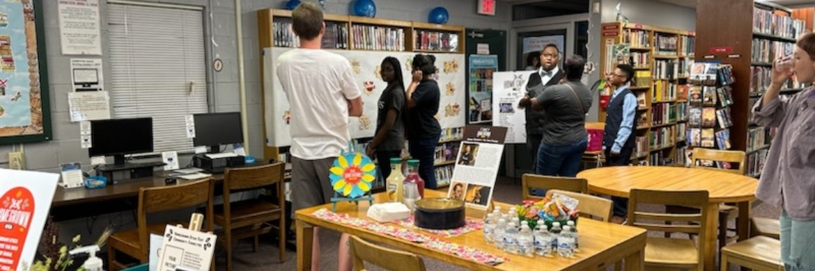 Group of teens standing in the library during a teen event